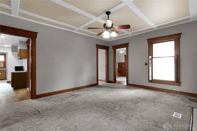 125 W Mound St, South Charleston, OH 45368 - spare room featuring coffered ceiling, ceiling fan, baseboards, and light carpet