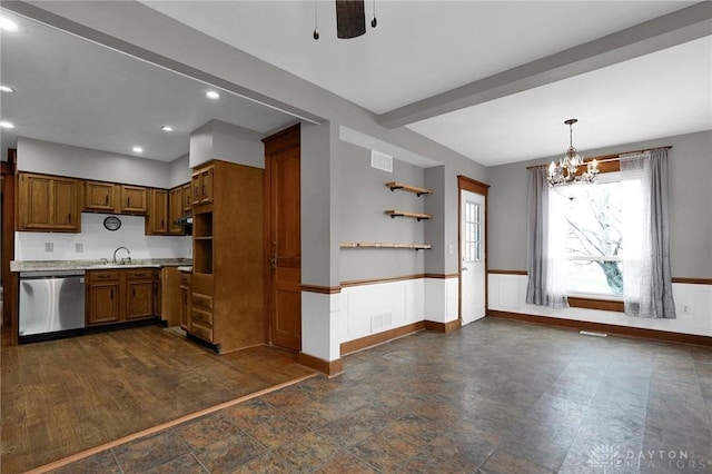 125 W Mound St, South Charleston, OH 45368 - kitchen featuring stainless steel dishwasher, a sink, light countertops, a chandelier, and brown cabinetry