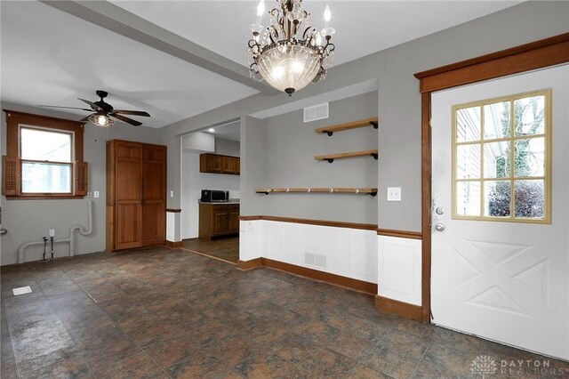 125 W Mound St, South Charleston, OH 45368 - interior space featuring a ceiling fan, a chandelier, and dark stone finish floors