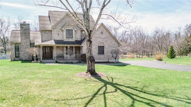 343 White Oak Dr, Chester Twp, OH 45177 - view of front of home featuring a porch, a chimney, and a front yard