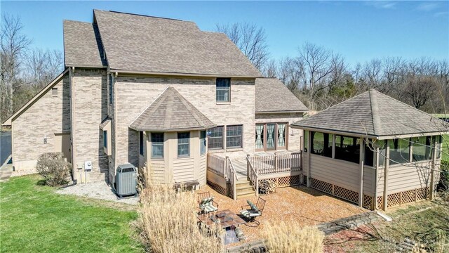 343 White Oak Dr, Chester Twp, OH 45177 - rear view of house featuring cooling unit, brick siding, a shingled roof, and a deck