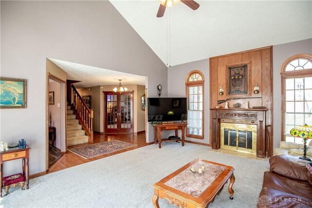 343 White Oak Dr, Chester Twp, OH 45177 - living area with carpet floors, baseboards, a large fireplace, a chandelier, and high vaulted ceiling