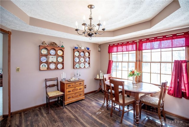 343 White Oak Dr, Chester Twp, OH 45177 - dining space with baseboards, a chandelier, a raised ceiling, dark wood-type flooring, and a textured ceiling