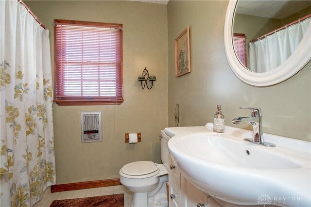 343 White Oak Dr, Chester Twp, OH 45177 - bathroom featuring toilet, tile patterned floors, vanity, heating unit, and a shower with shower curtain