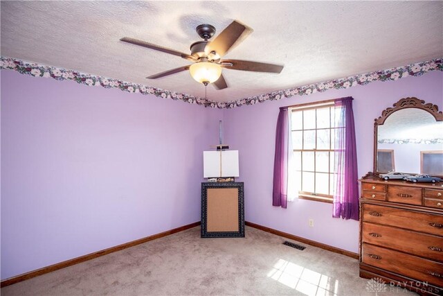 343 White Oak Dr, Chester Twp, OH 45177 - bedroom featuring a textured ceiling, baseboards, light colored carpet, and a ceiling fan