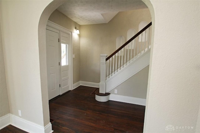 1716 Xenia Ave, Dayton, OH 45410 - foyer featuring hardwood / wood-style floors, arched walkways, baseboards, and stairs