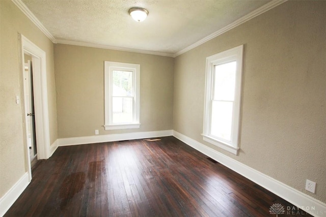 1716 Xenia Ave, Dayton, OH 45410 - spare room featuring dark wood-type flooring, crown molding, and baseboards