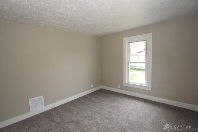 1716 Xenia Ave, Dayton, OH 45410 - carpeted empty room featuring a textured ceiling and baseboards