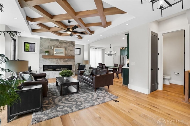 1000 Paradrome St, Cincinnati, OH 45202 - living area featuring a chandelier, plenty of natural light, a high end fireplace, light wood finished floors, and coffered ceiling