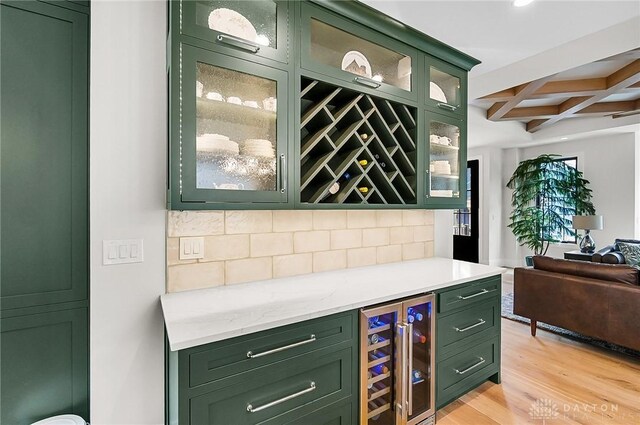 1000 Paradrome St, Cincinnati, OH 45202 - indoor dry bar with beverage cooler, coffered ceiling, backsplash, light wood-style floors, and beamed ceiling