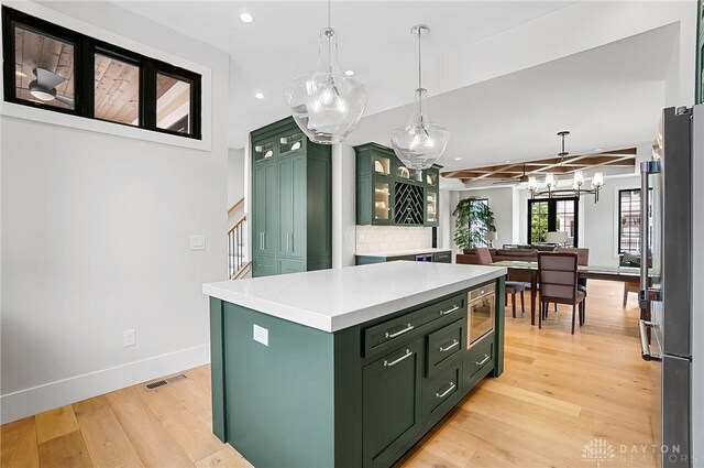 1000 Paradrome St, Cincinnati, OH 45202 - kitchen featuring green cabinetry, a chandelier, light countertops, recessed lighting, and baseboards