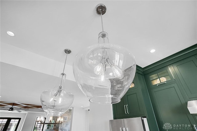 1000 Paradrome St, Cincinnati, OH 45202 - detailed view of green cabinets, freestanding refrigerator, a chandelier, recessed lighting, and hanging light fixtures