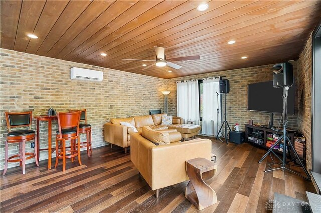 1000 Paradrome St, Cincinnati, OH 45202 - living room featuring a wall mounted air conditioner, wood ceiling, brick wall, hardwood / wood-style flooring, and a ceiling fan
