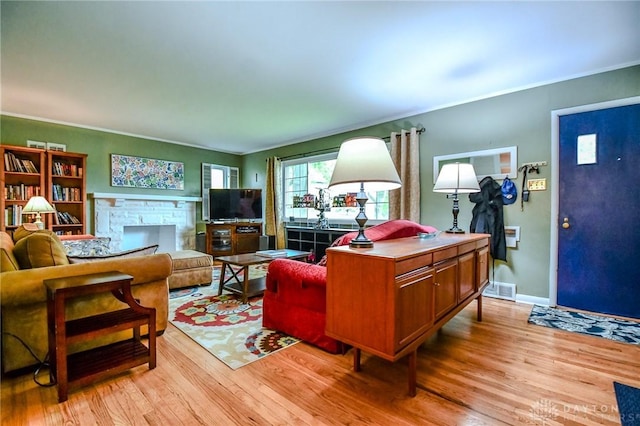 200 Maysfield Rd, Oakwood, OH 45419 - living area with light wood-type flooring, a stone fireplace, ornamental molding, and baseboards