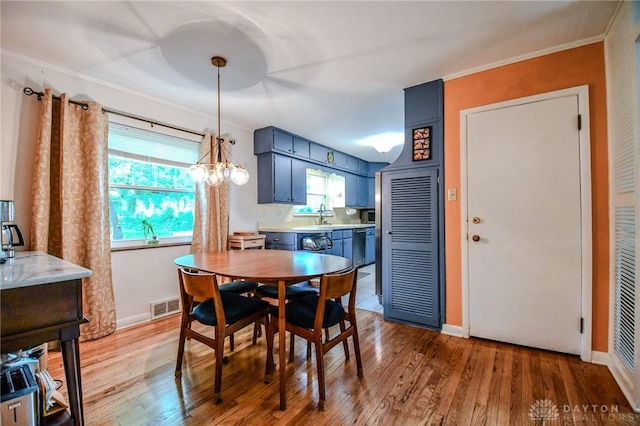 200 Maysfield Rd, Oakwood, OH 45419 - dining space with light wood-style floors, baseboards, ornamental molding, and a chandelier