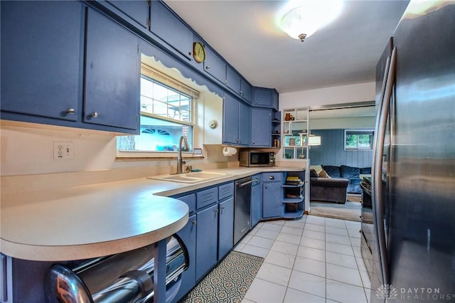 200 Maysfield Rd, Oakwood, OH 45419 - kitchen featuring appliances with stainless steel finishes, blue cabinets, open shelves, a sink, and light countertops