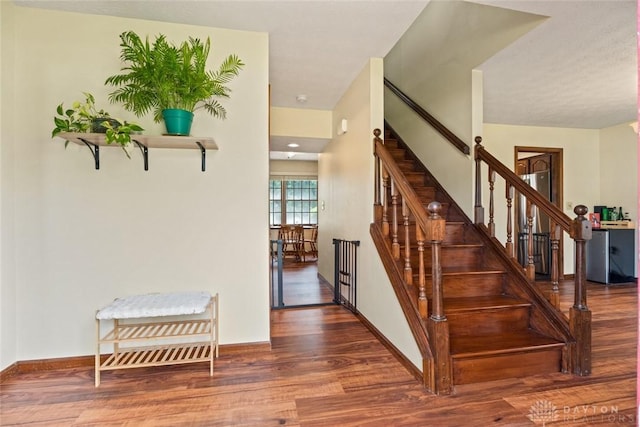 1747 Maple Ln, Beavercreek, OH 45432 - staircase featuring wood finished floors and baseboards