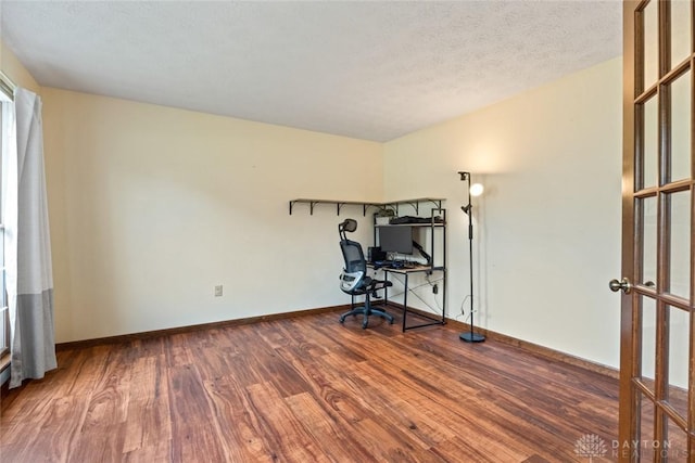 1747 Maple Ln, Beavercreek, OH 45432 - unfurnished office featuring wood finished floors, baseboards, and a textured ceiling