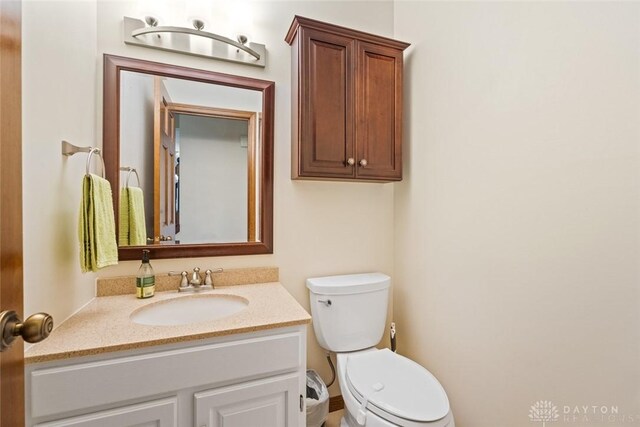 1747 Maple Ln, Beavercreek, OH 45432 - half bathroom featuring toilet and vanity