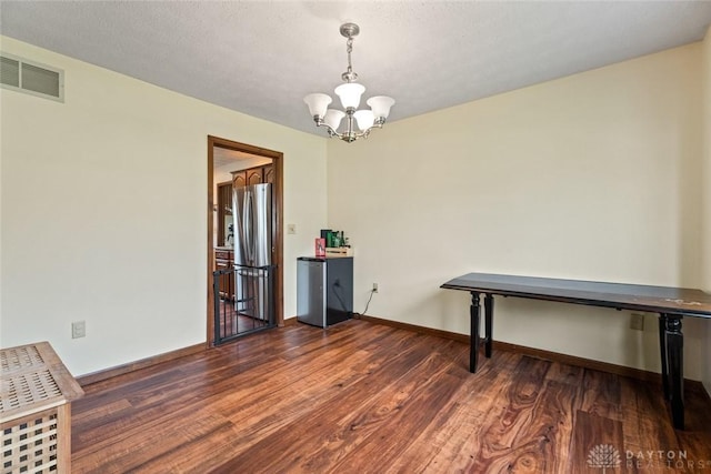 1747 Maple Ln, Beavercreek, OH 45432 - dining room with a chandelier, wood finished floors, and baseboards