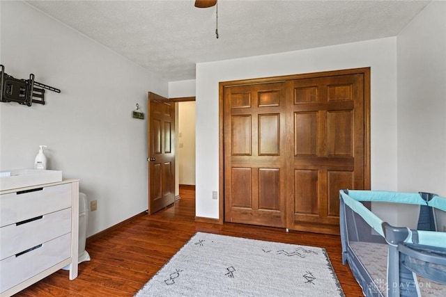 1747 Maple Ln, Beavercreek, OH 45432 - bedroom with dark wood finished floors, ceiling fan, a closet, and baseboards