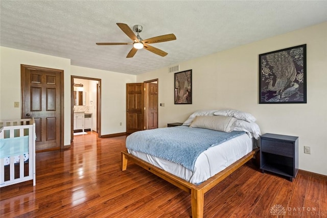 1747 Maple Ln, Beavercreek, OH 45432 - bedroom featuring wood finished floors, baseboards, a ceiling fan, and connected bathroom