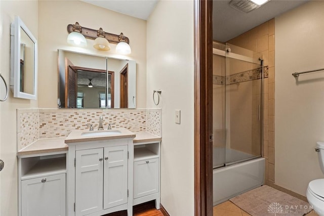1747 Maple Ln, Beavercreek, OH 45432 - bathroom with toilet, vanity, backsplash, combined bath / shower with glass door, and baseboards