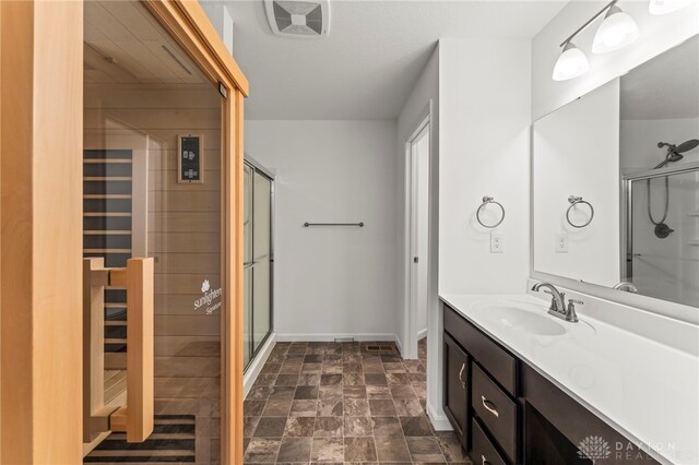1130 Arden Way, Fairborn, OH 45324 - full bath featuring vanity, a stall shower, baseboards, a relaxing sauna, and stone finish flooring