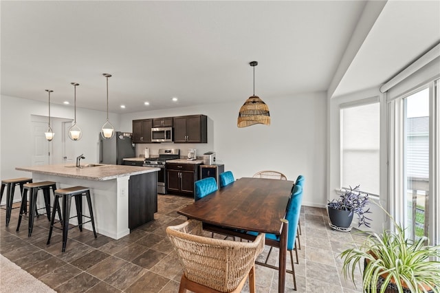 1130 Arden Way, Fairborn, OH 45324 - kitchen featuring stainless steel appliances, a sink, healthy amount of natural light, dark brown cabinetry, and recessed lighting