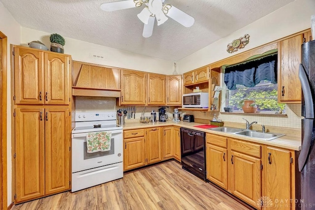 39 Spartan Dr, Oxford, OH 45056 - kitchen with white appliances, custom range hood, a sink, a textured ceiling, and light countertops