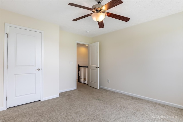 8730 Dowd Ct, Washington Twp, OH 45458 - unfurnished bedroom with light colored carpet, baseboards, and a ceiling fan