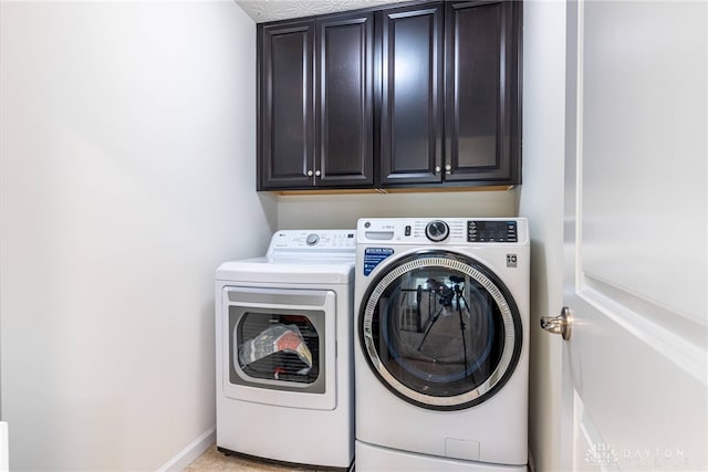 8730 Dowd Ct, Washington Twp, OH 45458 - laundry area with cabinet space, washer and dryer, and baseboards