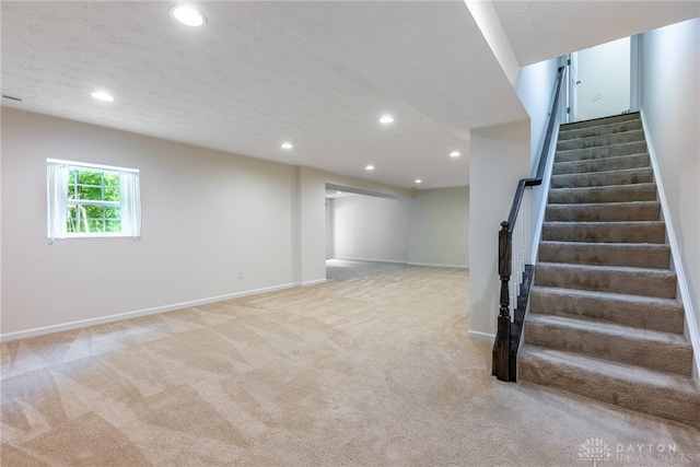 8730 Dowd Ct, Washington Twp, OH 45458 - basement with recessed lighting, light colored carpet, stairway, and baseboards