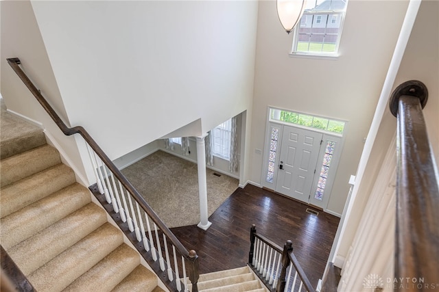 8730 Dowd Ct, Washington Twp, OH 45458 - entrance foyer with plenty of natural light, wood finished floors, stairway, and a towering ceiling