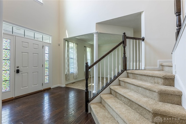 8730 Dowd Ct, Washington Twp, OH 45458 - entryway featuring healthy amount of natural light, hardwood / wood-style flooring, stairs, baseboards, and a towering ceiling