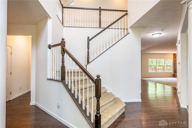 8730 Dowd Ct, Washington Twp, OH 45458 - staircase featuring wood finished floors and baseboards
