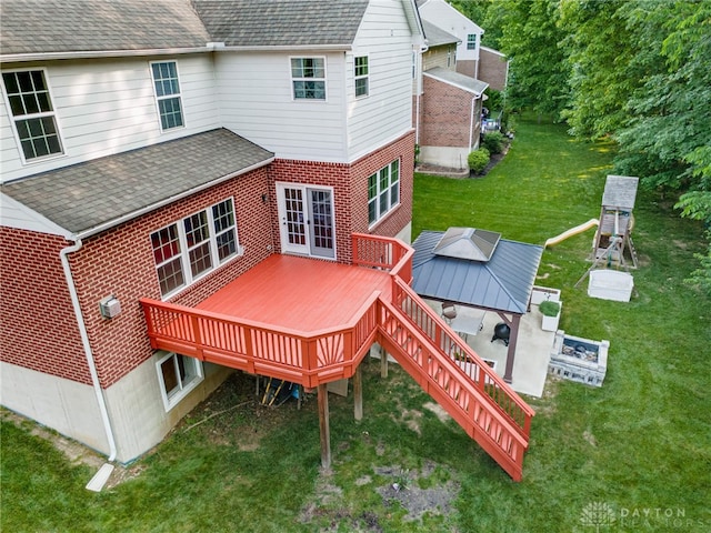 8730 Dowd Ct, Washington Twp, OH 45458 - rear view of property featuring a wooden deck, brick siding, a yard, and a shingled roof