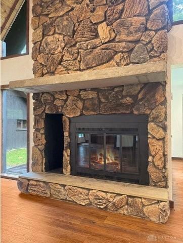 5565 Short Rd, New Carlisle, OH 45344 - detailed view of a stone fireplace and wood finished floors