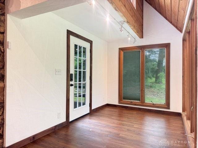 5565 Short Rd, New Carlisle, OH 45344 - unfurnished sunroom with track lighting, healthy amount of natural light, and vaulted ceiling
