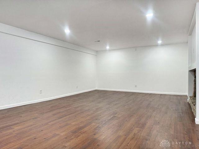 5565 Short Rd, New Carlisle, OH 45344 - finished basement with dark wood-type flooring, baseboards, and recessed lighting