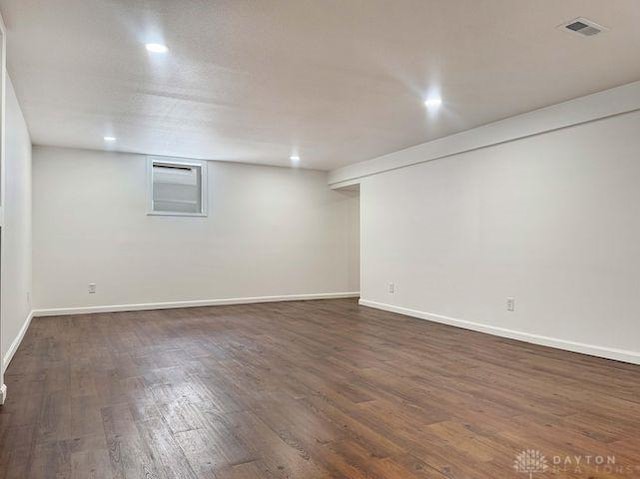 5565 Short Rd, New Carlisle, OH 45344 - finished basement with dark wood-style flooring, baseboards, and recessed lighting