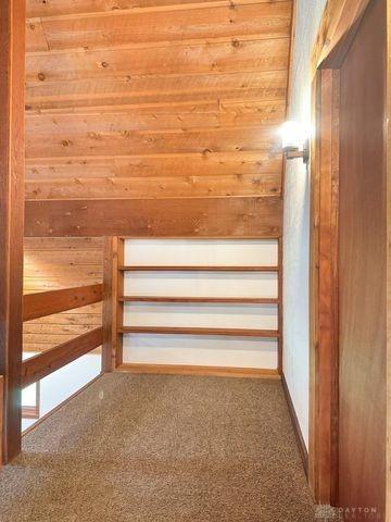 5565 Short Rd, New Carlisle, OH 45344 - bonus room with wood walls and carpet