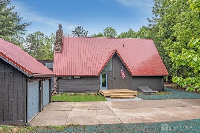 5565 Short Rd, New Carlisle, OH 45344 - view of front of house with metal roof and a chimney