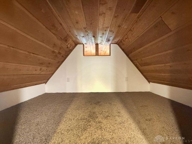 5565 Short Rd, New Carlisle, OH 45344 - bonus room featuring wooden ceiling, vaulted ceiling, and carpet floors