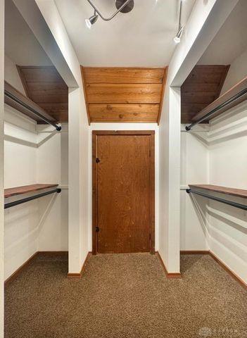 5565 Short Rd, New Carlisle, OH 45344 - walk in closet featuring carpet