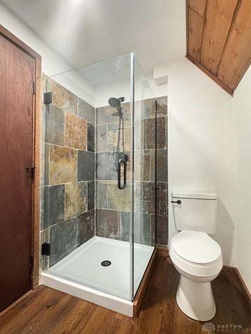 5565 Short Rd, New Carlisle, OH 45344 - full bathroom featuring toilet, a shower stall, and wood finished floors