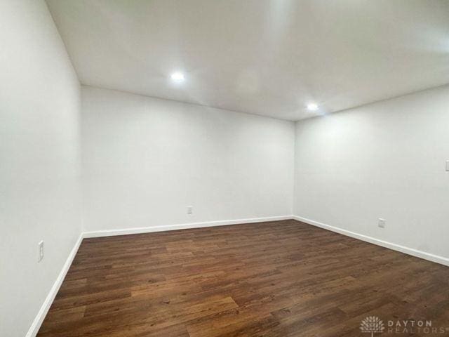 5565 Short Rd, New Carlisle, OH 45344 - unfurnished room with baseboards, dark wood-type flooring, and recessed lighting