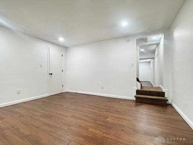 5565 Short Rd, New Carlisle, OH 45344 - basement with dark wood-style floors, recessed lighting, baseboards, and stairs