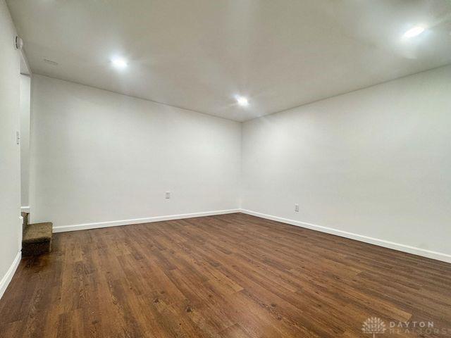 5565 Short Rd, New Carlisle, OH 45344 - spare room with dark wood-style flooring, baseboards, and recessed lighting