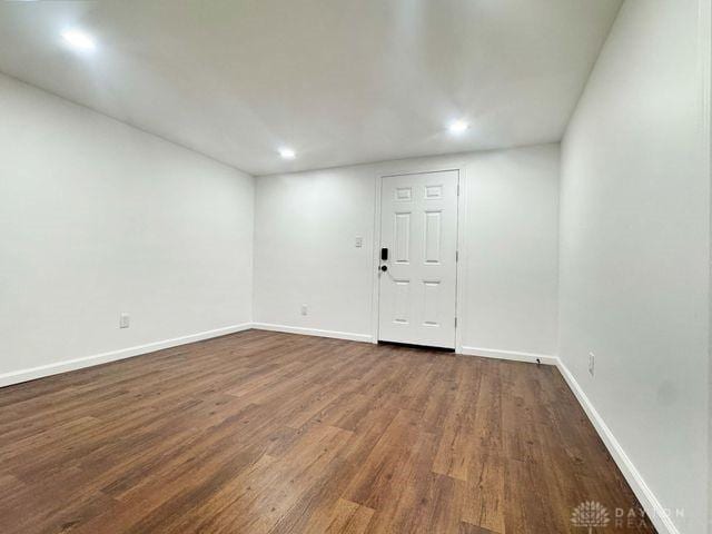 5565 Short Rd, New Carlisle, OH 45344 - empty room with dark wood-type flooring, recessed lighting, and baseboards